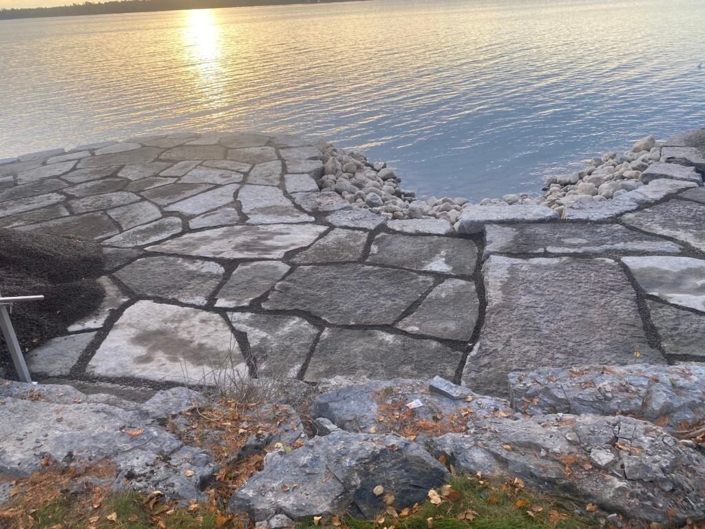 Flagstone shoreline terrace on the lake at sunset