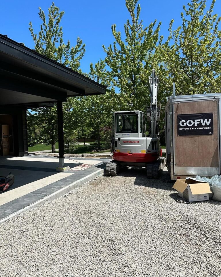 Tight squeeze for the mini excavator. Thor Construction job photo.