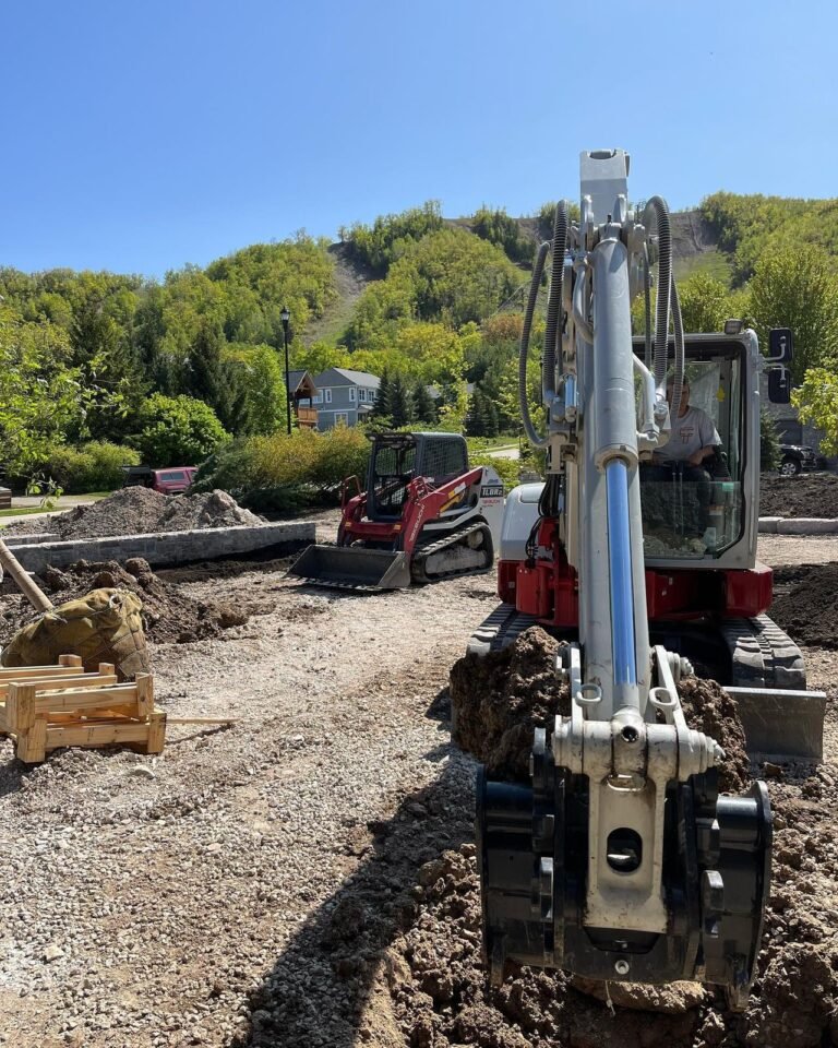 Finishing a landscape build. Thor Construction job photo.