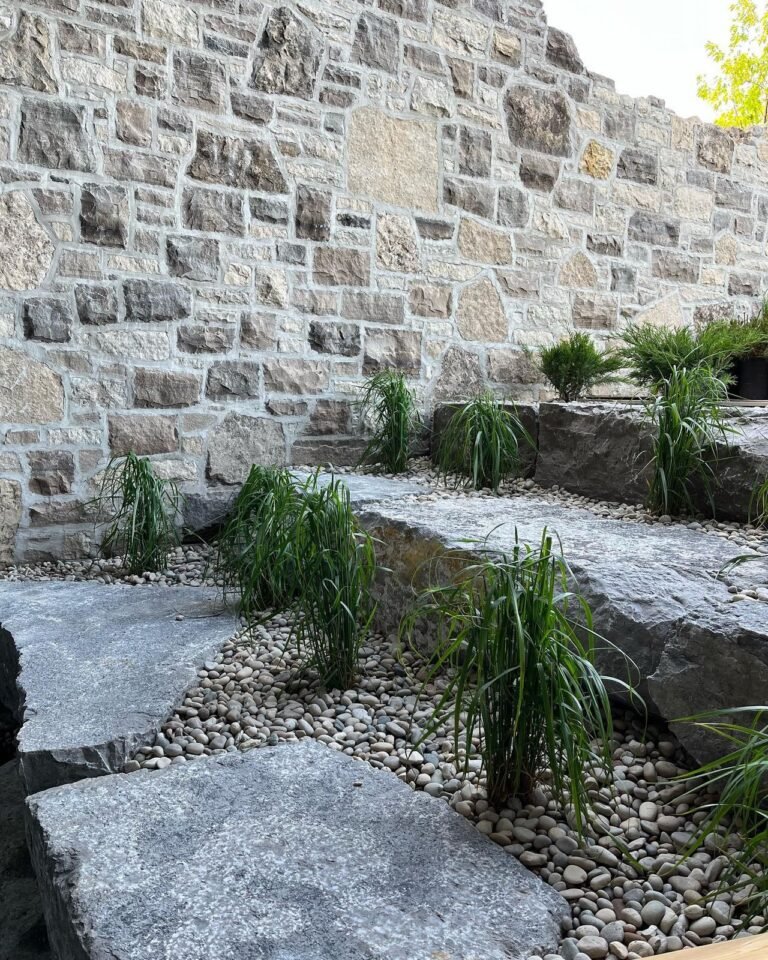 Tiered armour stone garden beds. Thor Construction job photo.