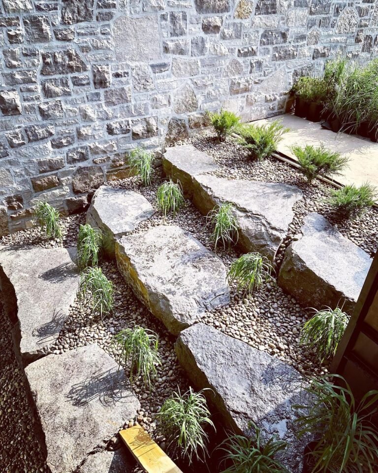Tiered armour stone garden beds. Thor Construction job photo.
