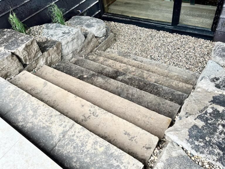 Natural stone staircase on a free-draining base. Thor Construction job photo.