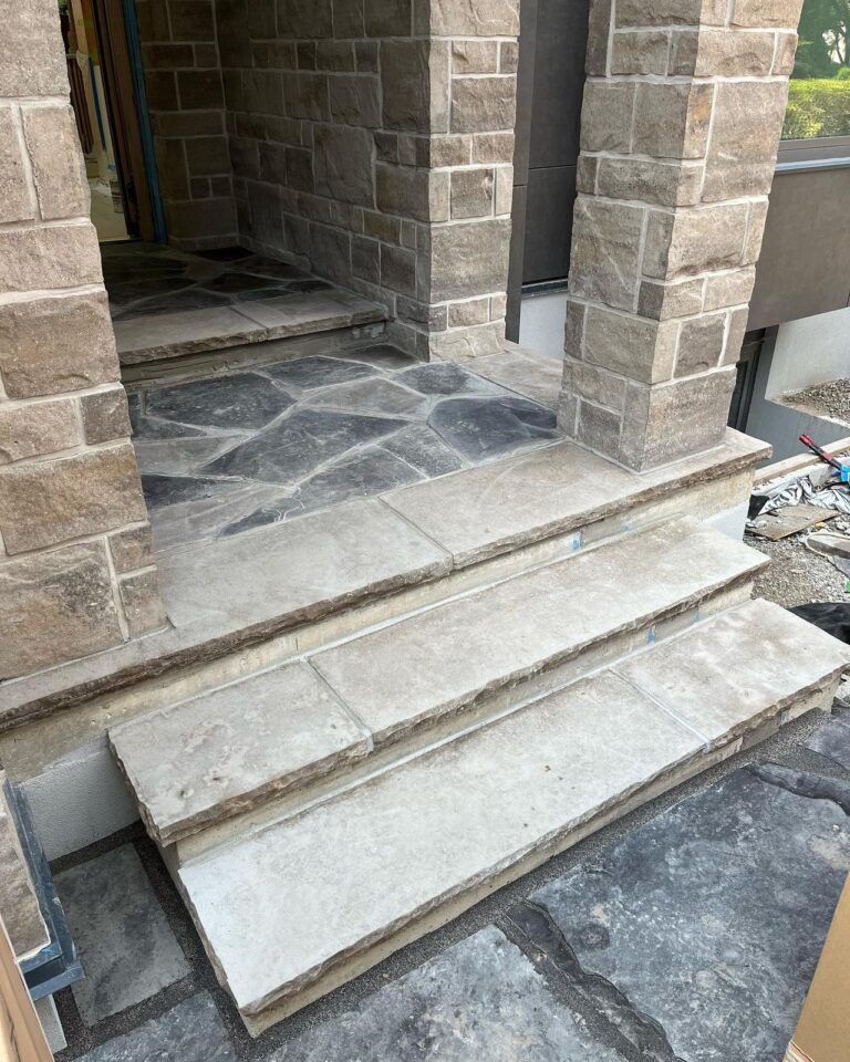 Stone copings and a flagstone porch. Thor Construction job photo.