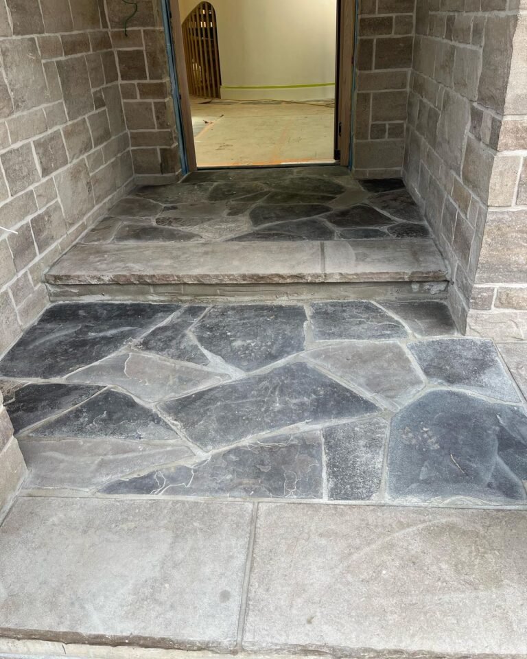 Stone copings and a flagstone porch. Thor Construction job photo.