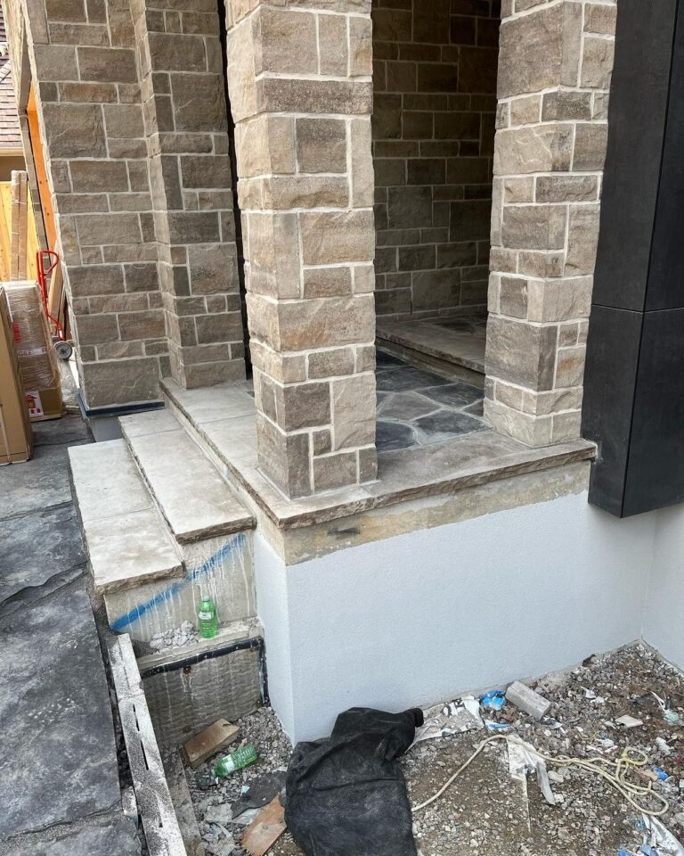 Stone copings and a flagstone porch. Thor Construction job photo.