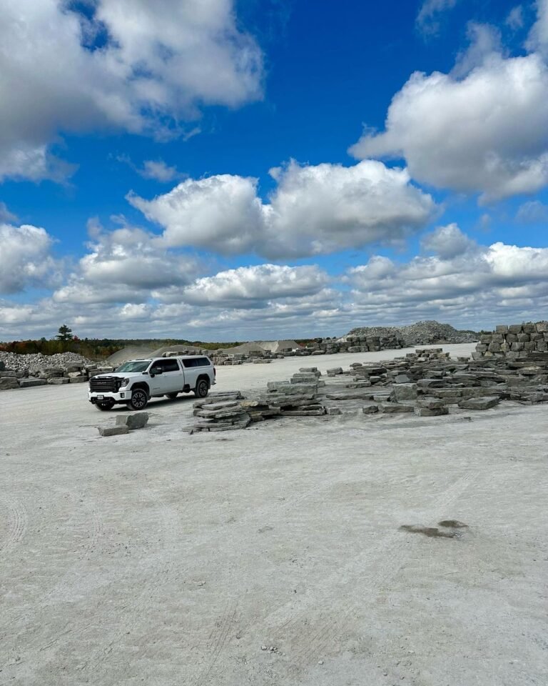 Picking armour stone and steps at the quarry, Buckhorn. Thor Construction job photo.
