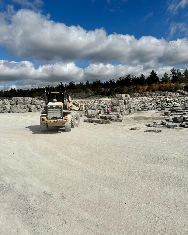Picking armour stone and steps at the quarry, Buckhorn. Thor Construction job photo.