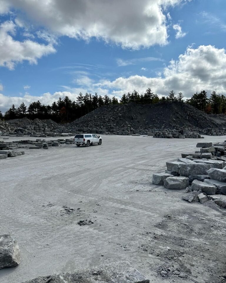 Picking armour stone and steps at the quarry, Buckhorn. Thor Construction job photo.