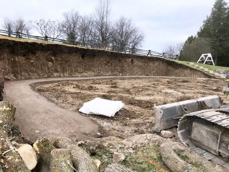 Armour stone retaining wall build, Kawartha Lakes. Thor Construction job photo.