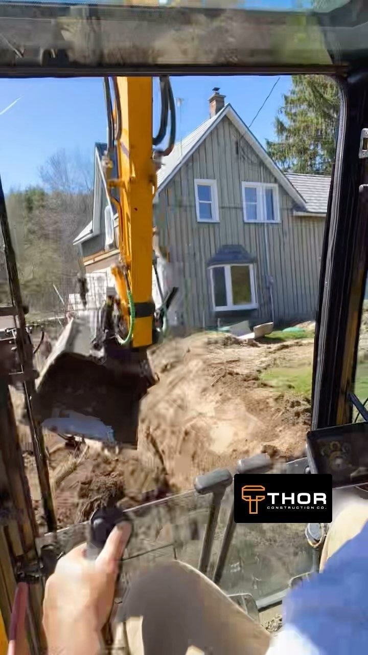 Root removal and a drainage dig around a house. Thor Construction job video.