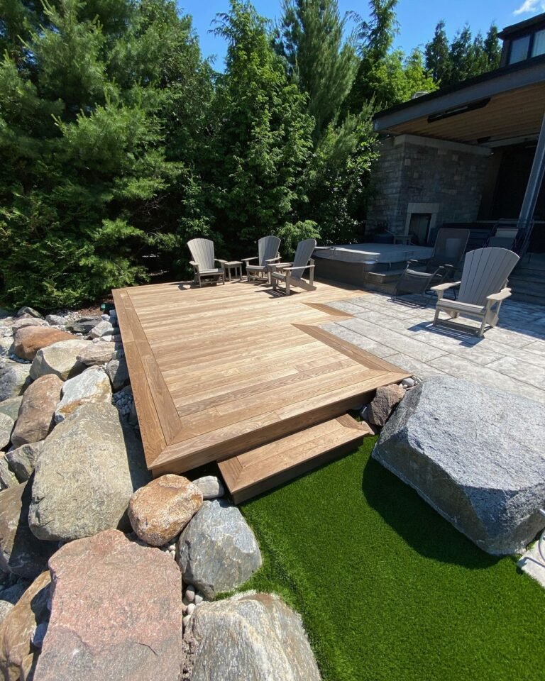 Thermally modified deck set into a natural stone patio. Thor Construction job photo.