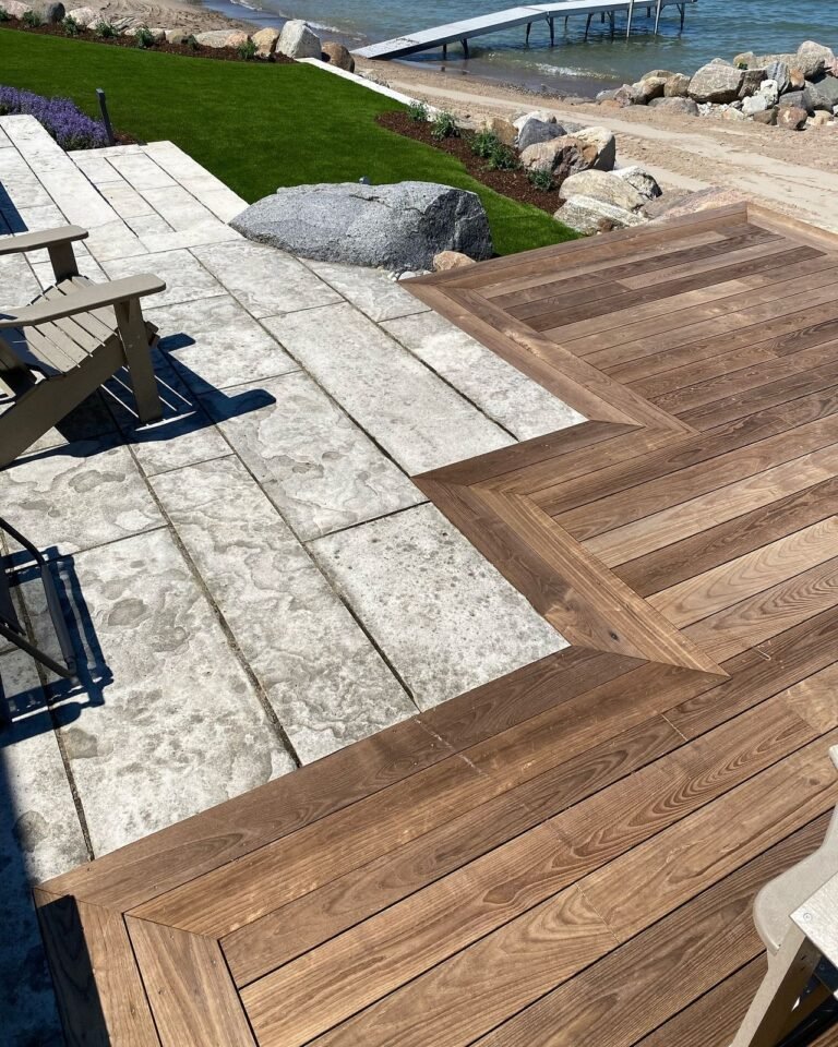 Thermally modified deck set into a natural stone patio. Thor Construction job photo.