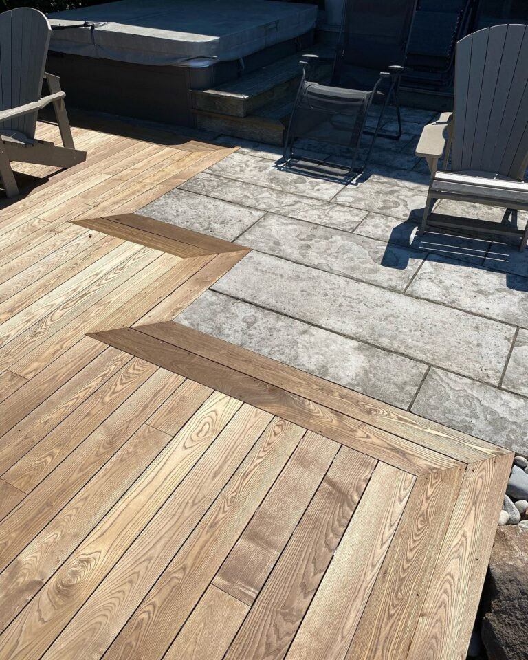 Thermally modified deck set into a natural stone patio. Thor Construction job photo.