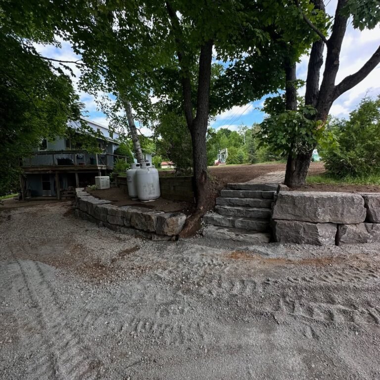 Armour stone retaining wall and natural stone steps, Catchacoma. Thor Construction job photo.