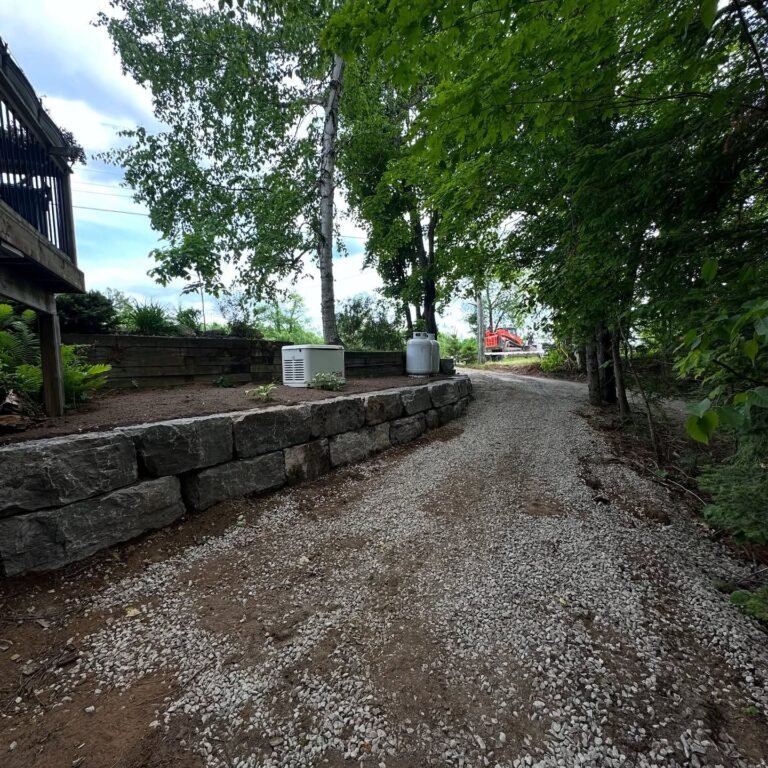 Armour stone retaining wall and natural stone steps, Catchacoma. Thor Construction job photo.