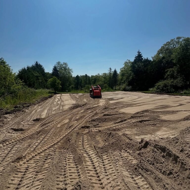 Blowing septic sand onto a Type A dispersal bed, Stouffville. Thor Construction job photo.