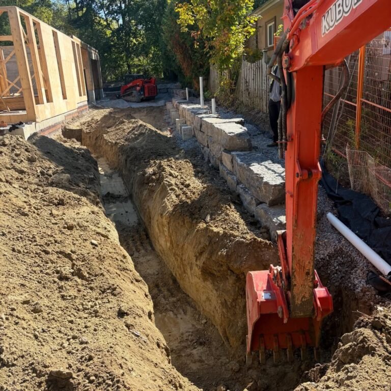Trenching for hydro on a tight site, Stouffville. Thor Construction job photo.