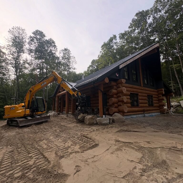 Grading around a custom log home, Minden. Thor Construction job photo.