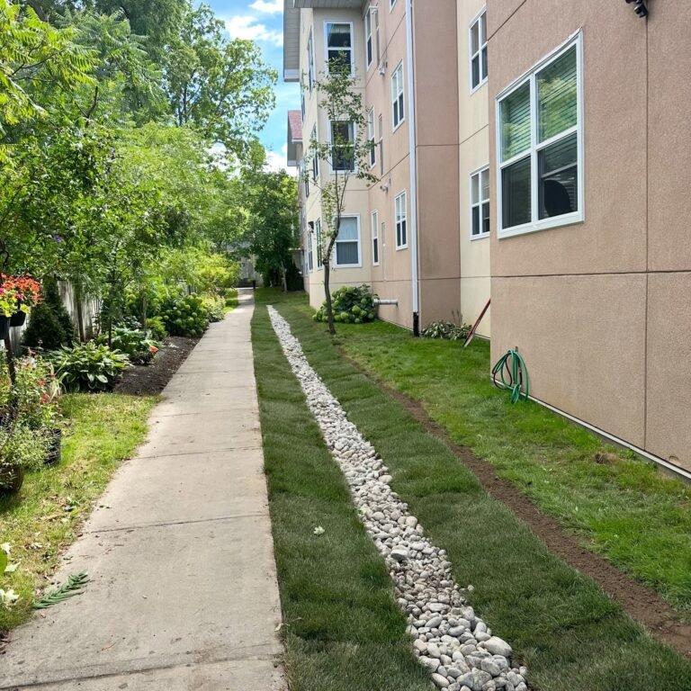 Drainage trench beside a walkway, Lindsay. Thor Construction job photo.