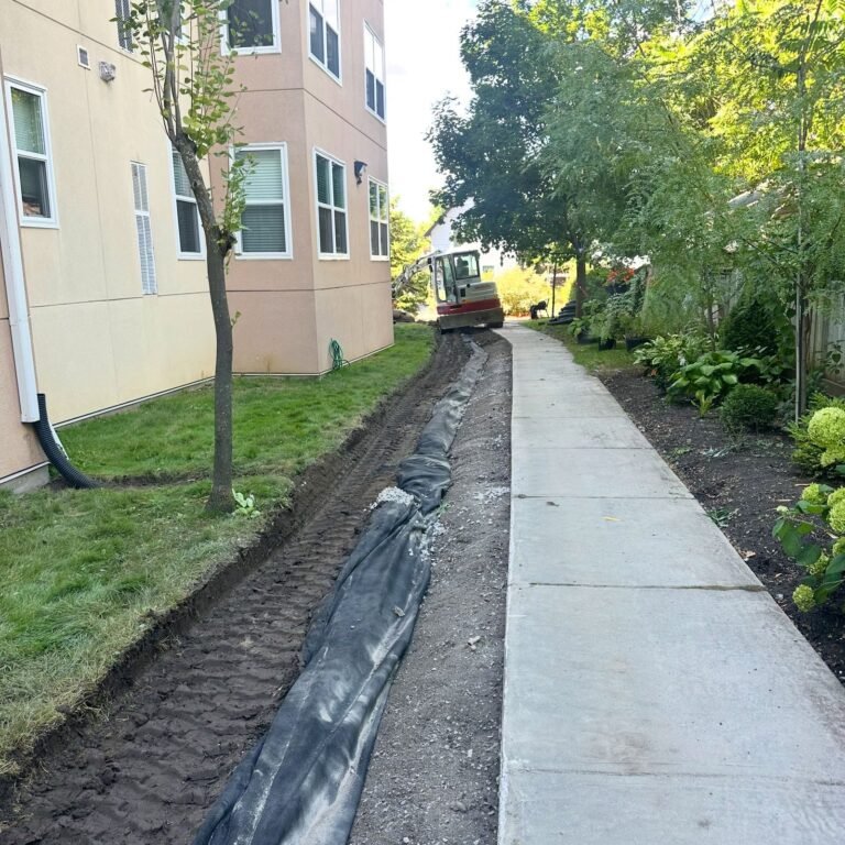 Drainage trench beside a walkway, Lindsay. Thor Construction job photo.