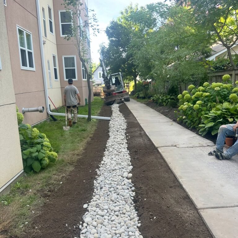 Drainage trench beside a walkway, Lindsay. Thor Construction job photo.